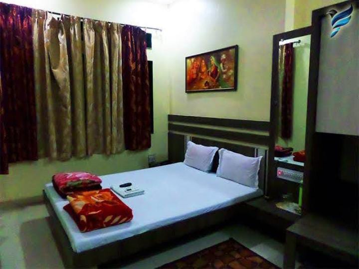 Cozy double room with framed devotional art