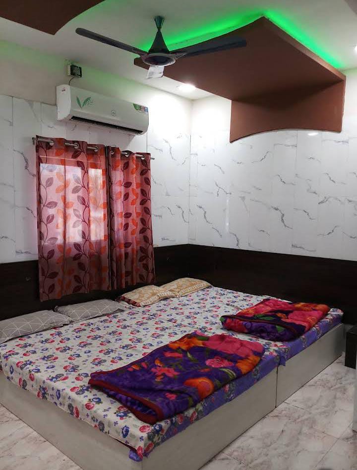 Spacious triple bed room with modern ceiling design